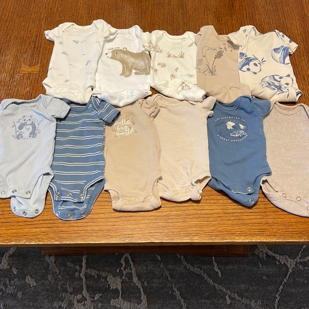 11 Carters onesies. Size preemie.